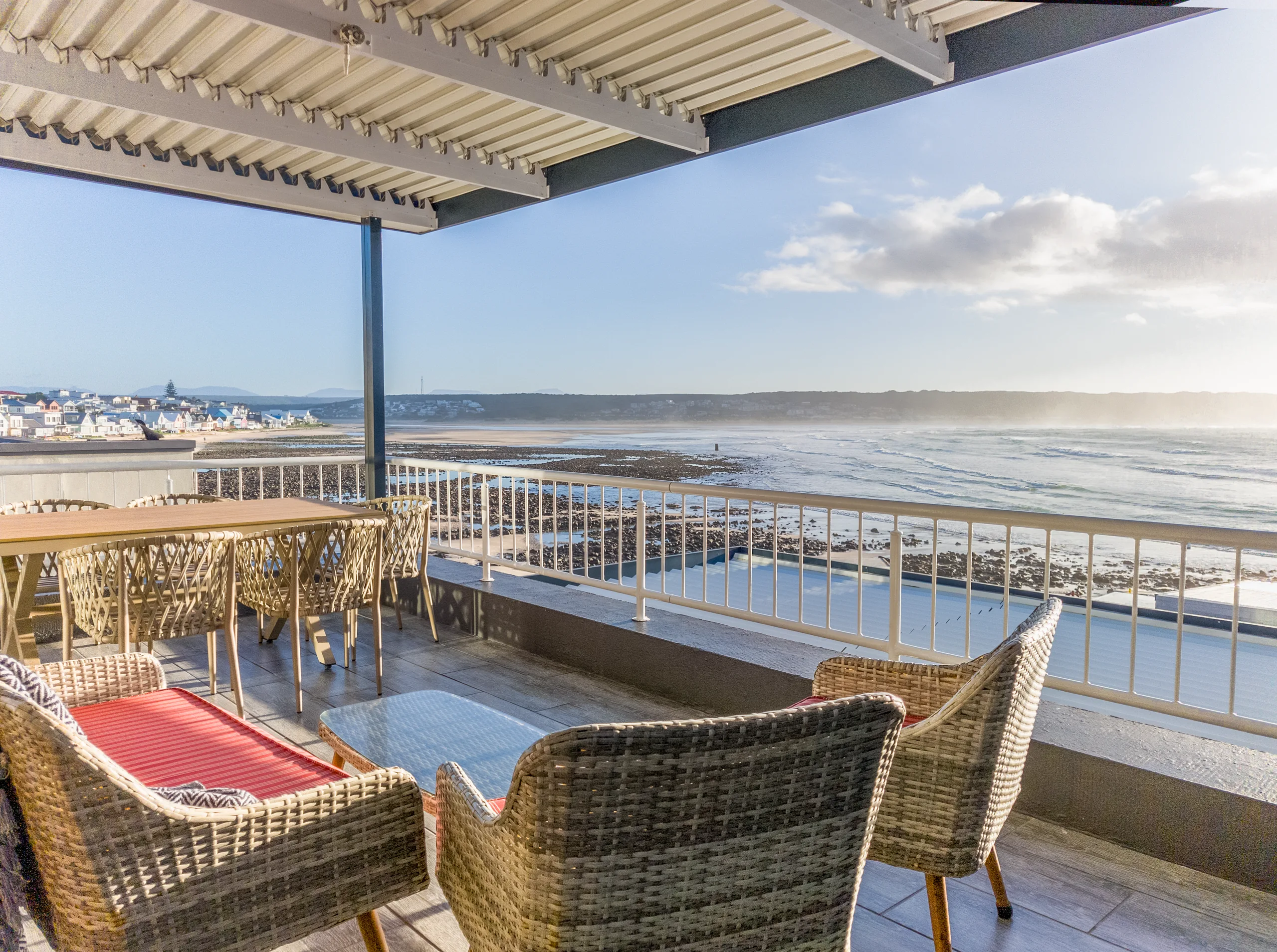 Covered patio with braai and dining table, Unit Two, Die Hawehuis