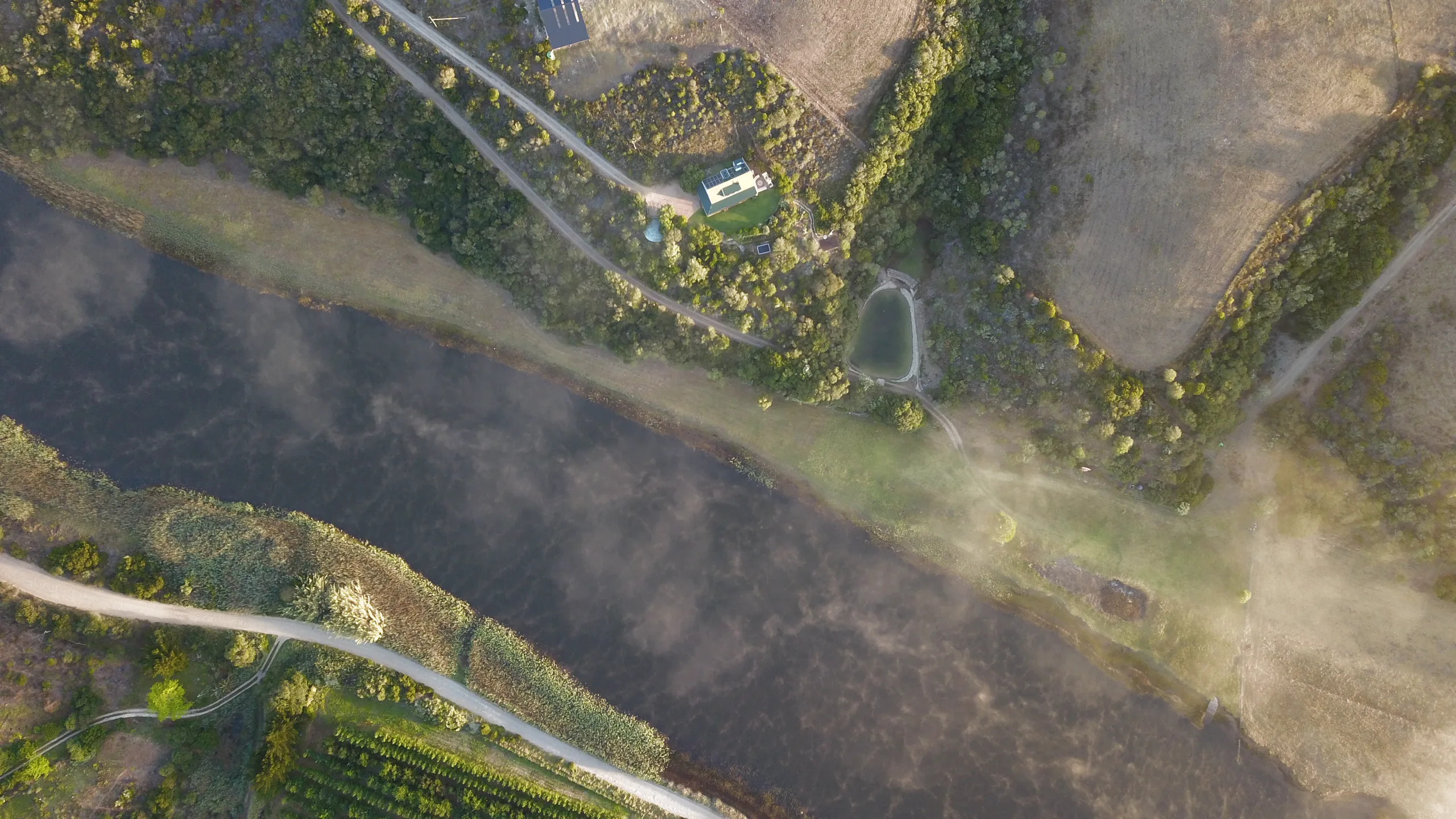 Aerial view of the Goukou River meander through olive country