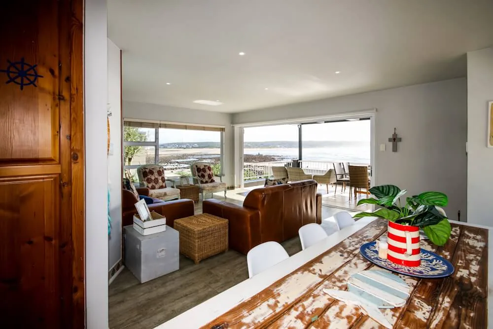 Open-plan lounge with sea views, Unit One, Die Hawehuis